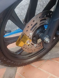 TRAVA DISCO ALUMÍNIO (UND) DOURADO